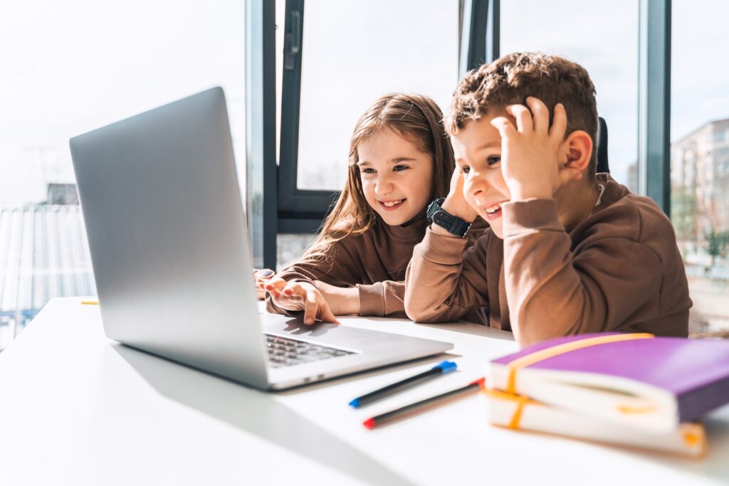 Boy and girl at laptop. Distance education
